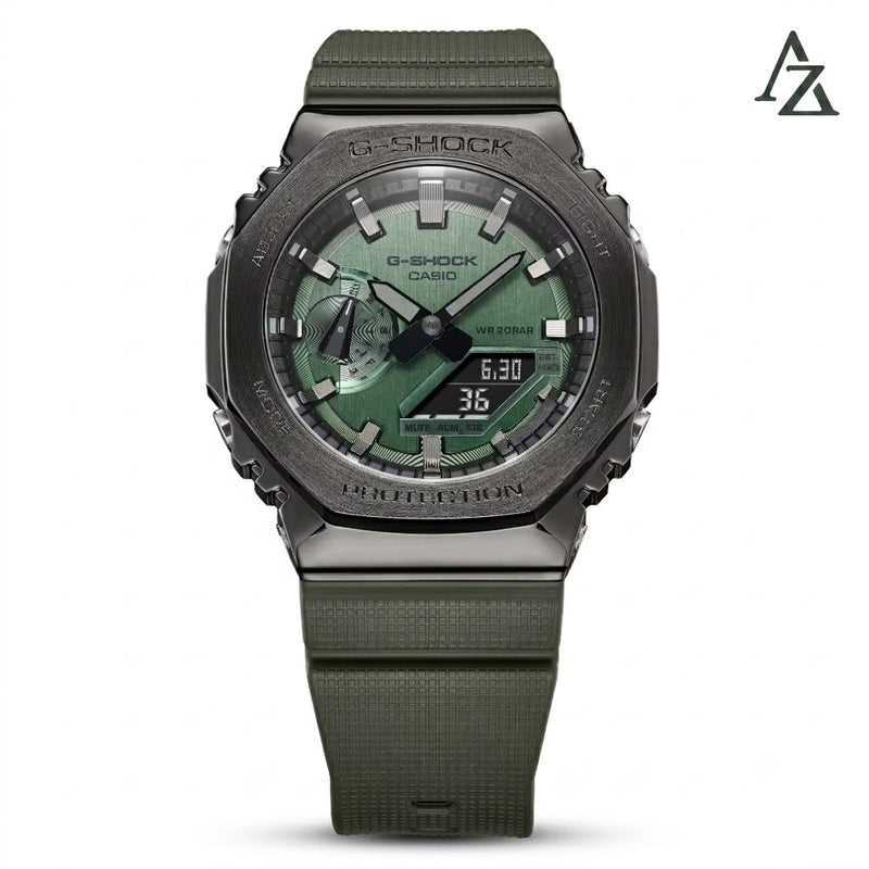 A Casio G-Shock watch with an olive green textured strap and a dark gray metallic case, featuring a green dial with black hands and digital displays.