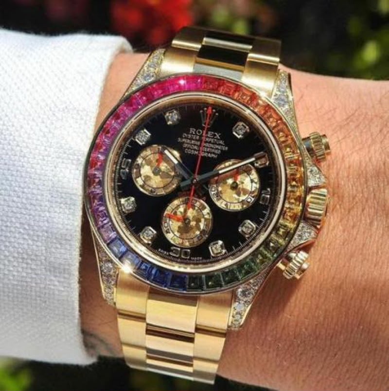 Rolex Daytona inspired gold tone chronograph watch with rainbow bezel