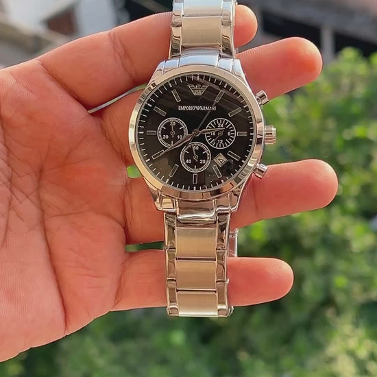 Black dial men's chronograph style watch with three sub-dials
