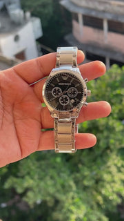 Black dial men's chronograph style watch with three sub-dials