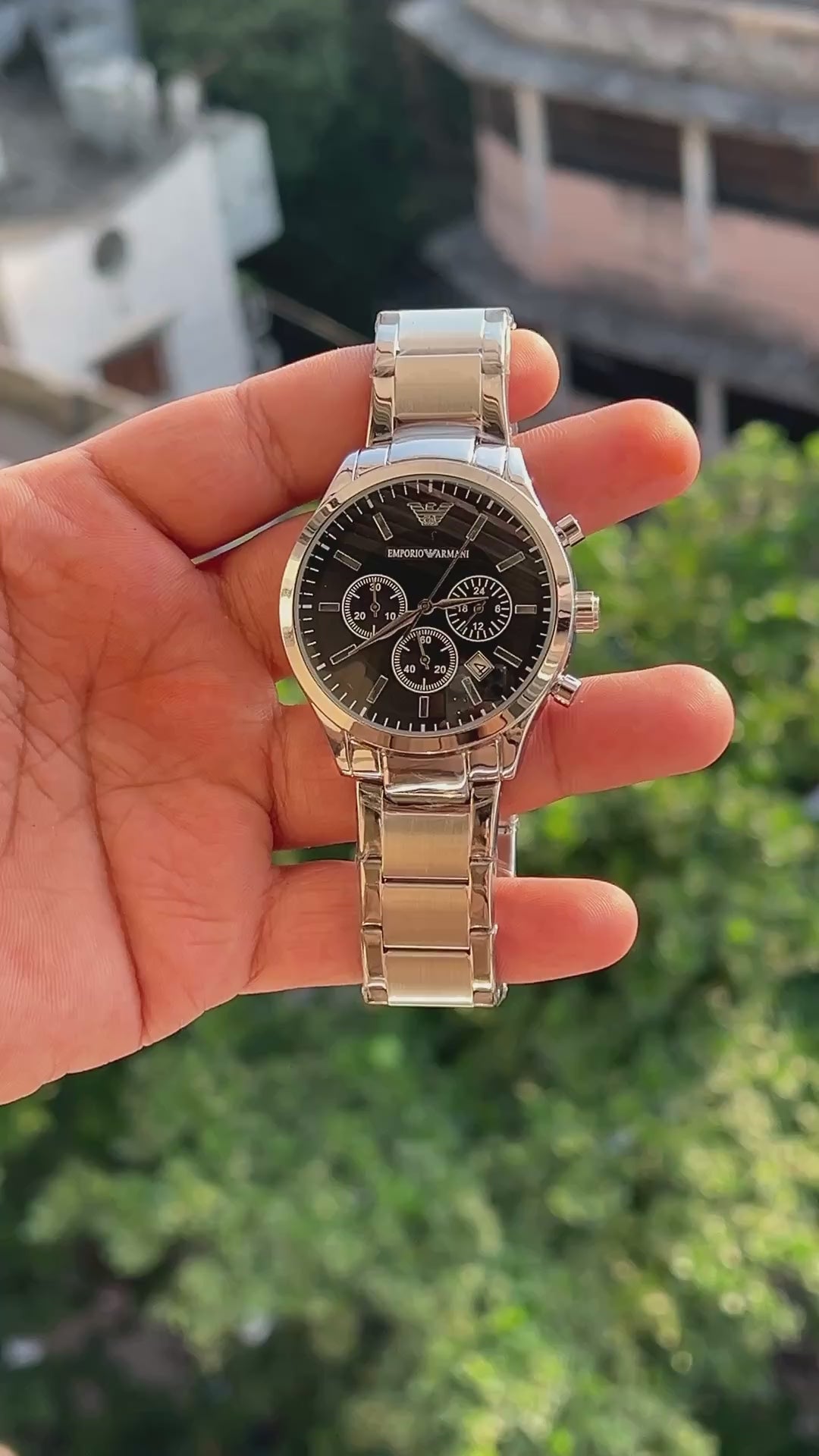 Black dial men's chronograph style watch with three sub-dials