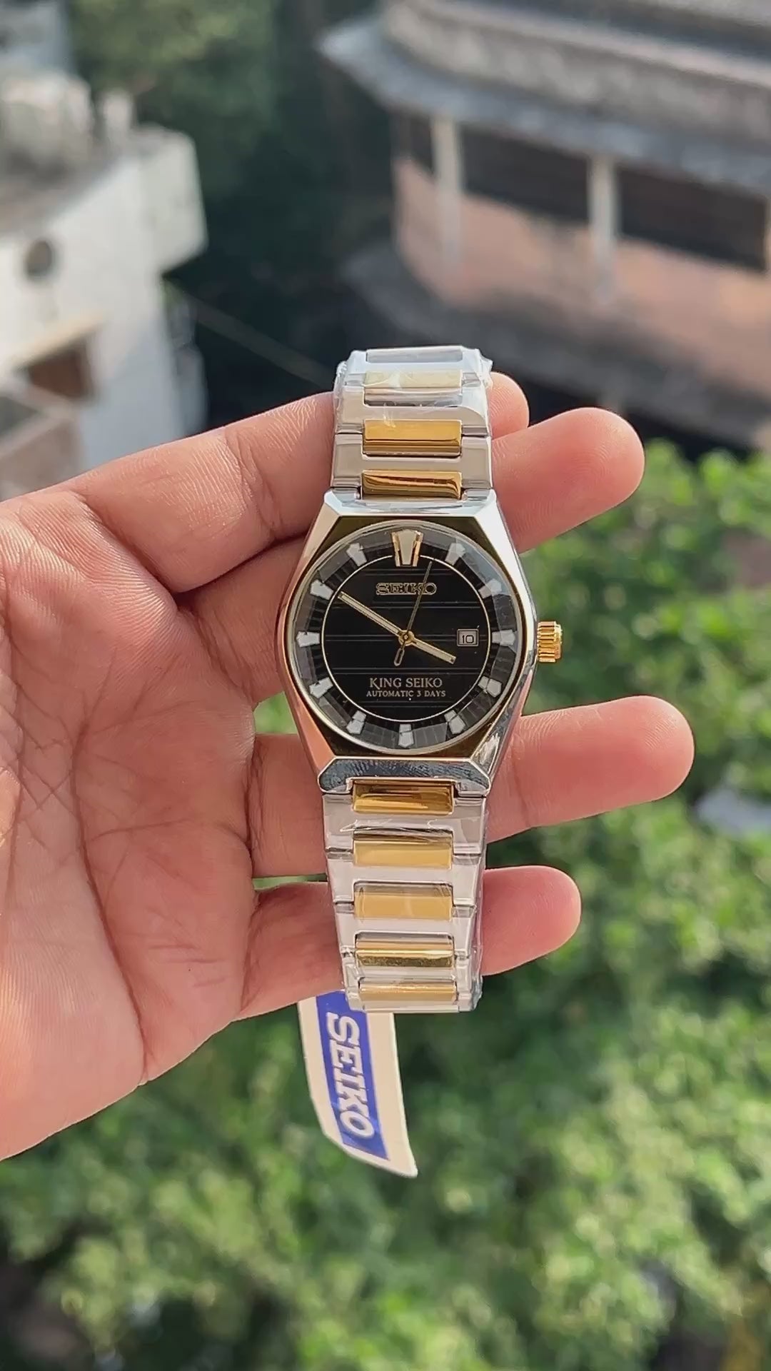 King Seiko inspired black dial watch with gold tone hands and markers