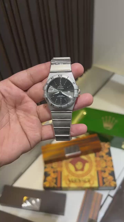 Omega Constellation Watch – First Copy | Master Copy Quality | Black Dial, Integrated Steel Bracelet